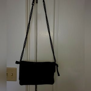 A soft, black leather bag with chain and lots of compartments